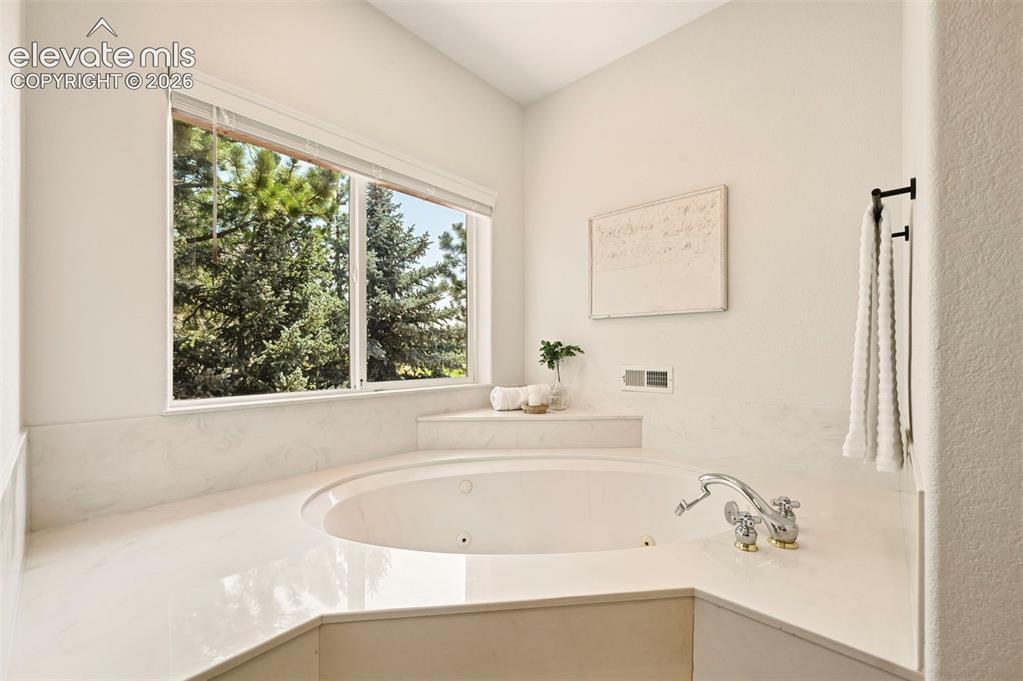 Image 10 of 50: Primary Bedroom with private access 5 piece bathroom