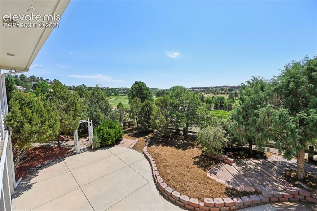 Image 25 of 50: Colorado Room, enclosed back deck with golf course views