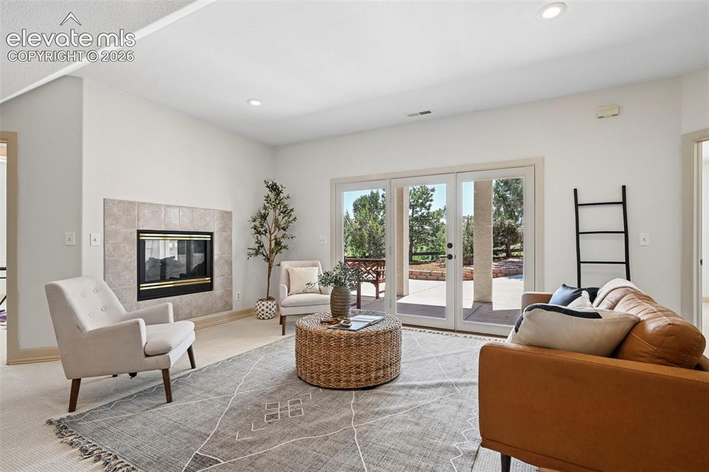 Image 26 of 50: Colorado Room, enclosed back deck with golf course views