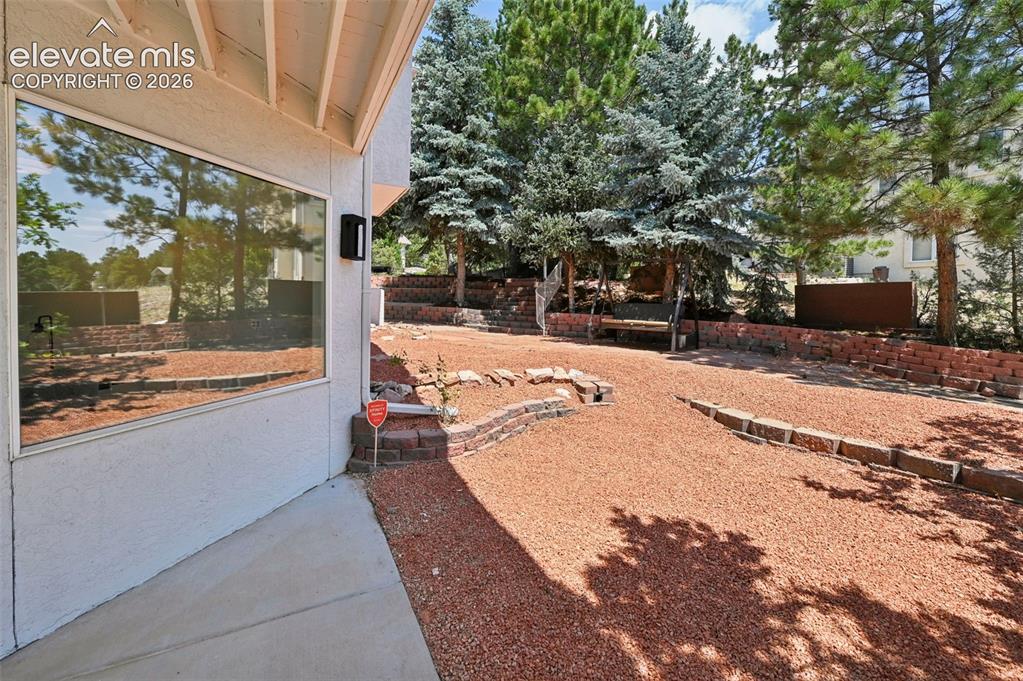 Image 45 of 50: Xeriscaped back of 19K sqft lot, with walways