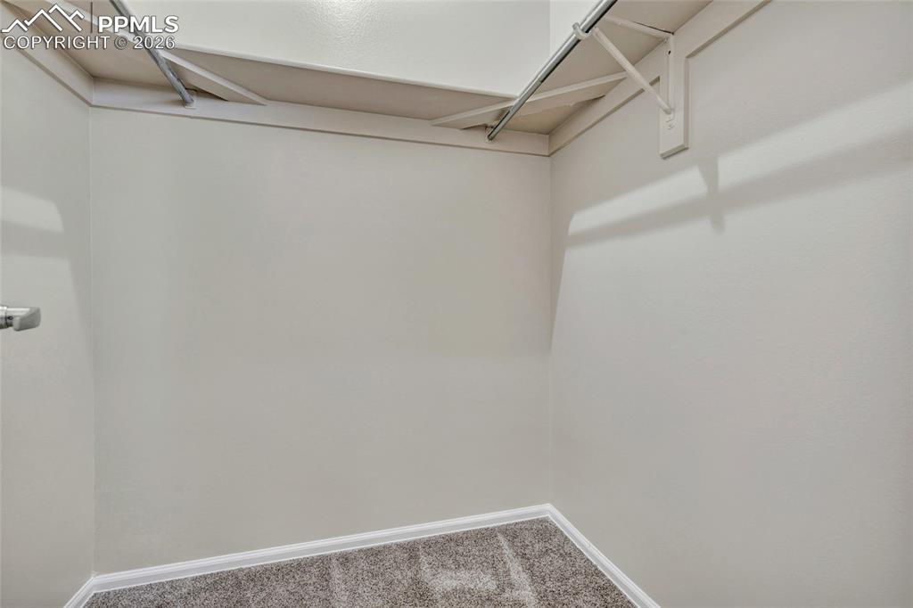 Image 17 of 24: Walk-in closet