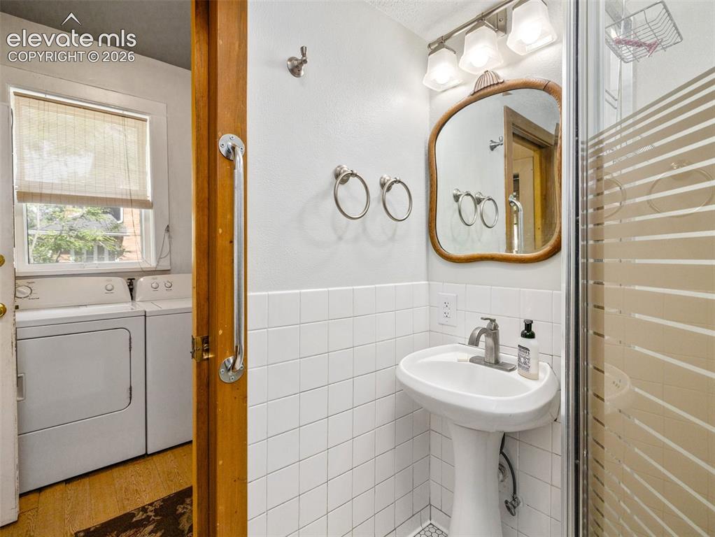 Image 13 of 49: 3/4 bath off laundry area
