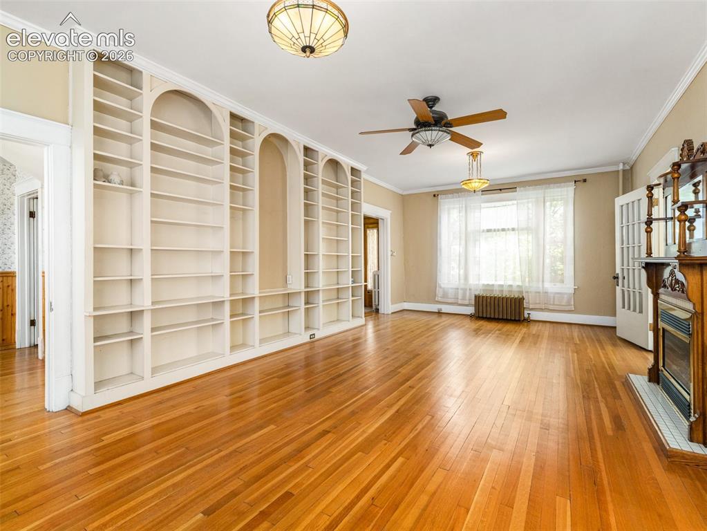 Image 17 of 49: Built in book cases in the living room