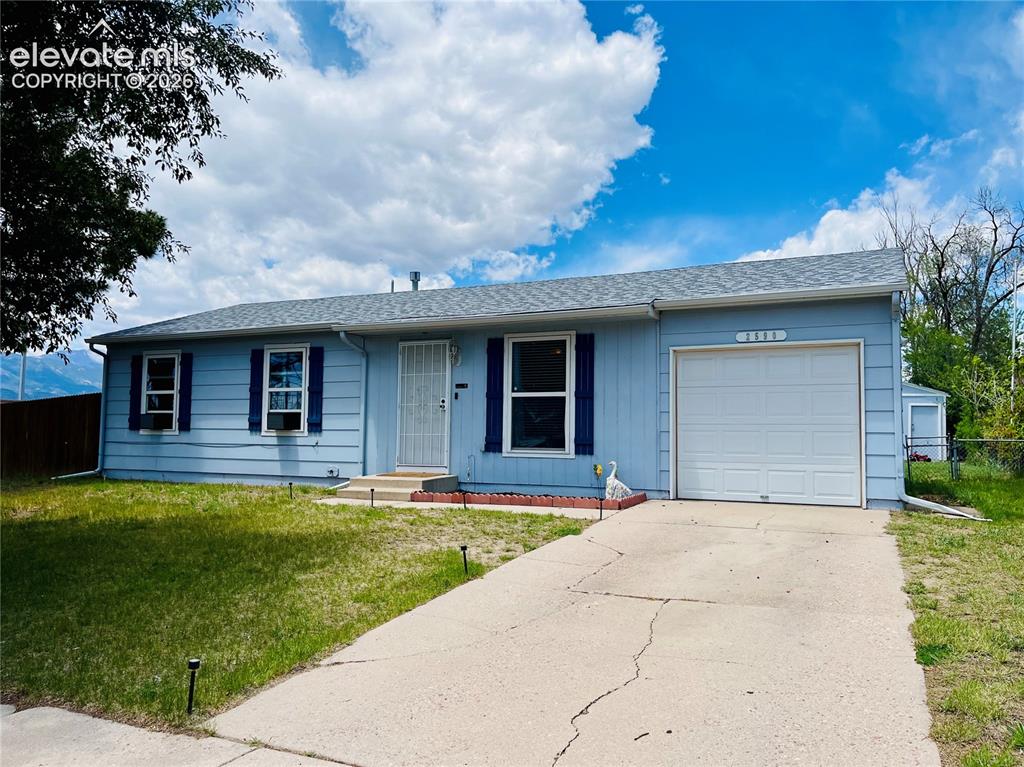 Image 1 of 21: Ranch style home with attached garage and corner lot location