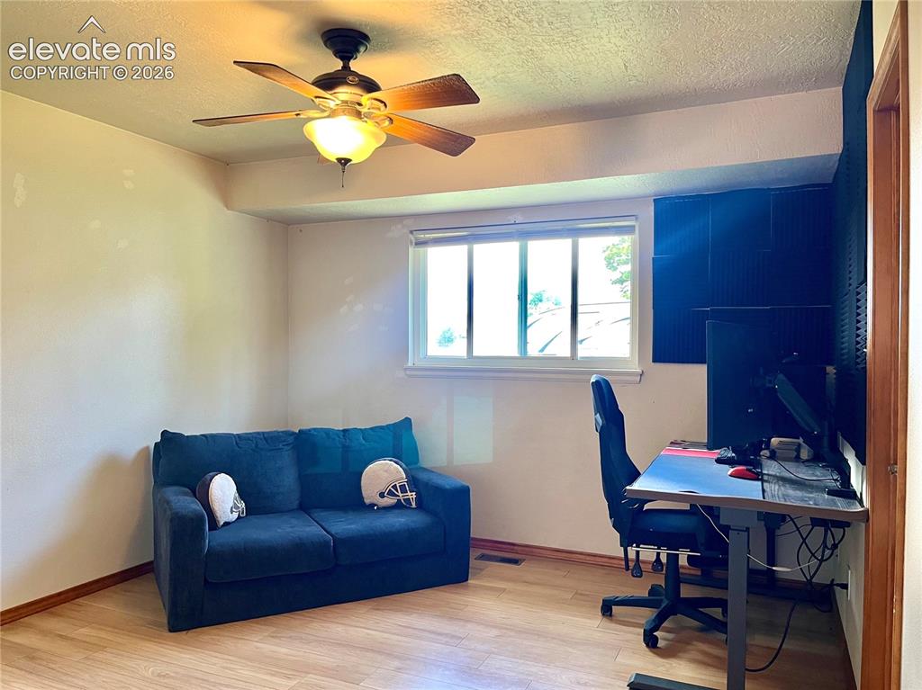 Image 11 of 21: Secondary bedroom ideal for office, guests, or hobbies