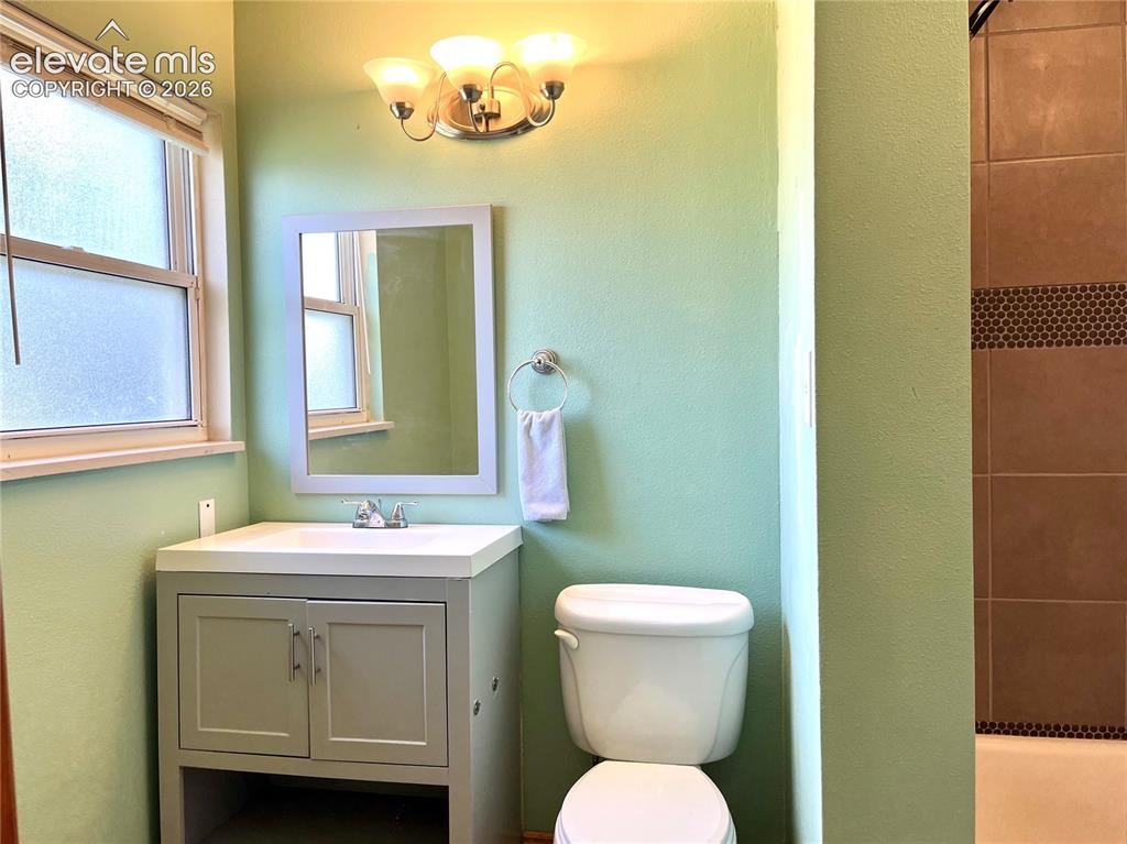 Image 15 of 21: Full bathroom with updated vanity