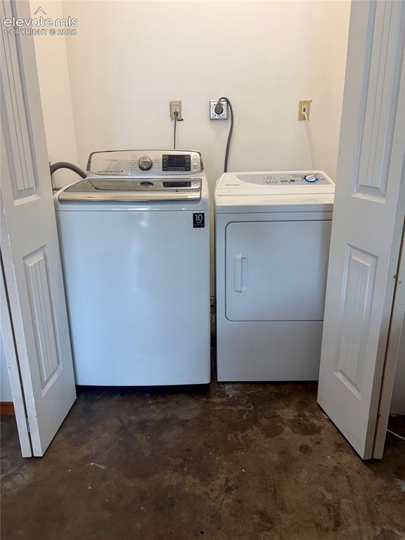 Image 18 of 21: Laundry space with washer and dryer included