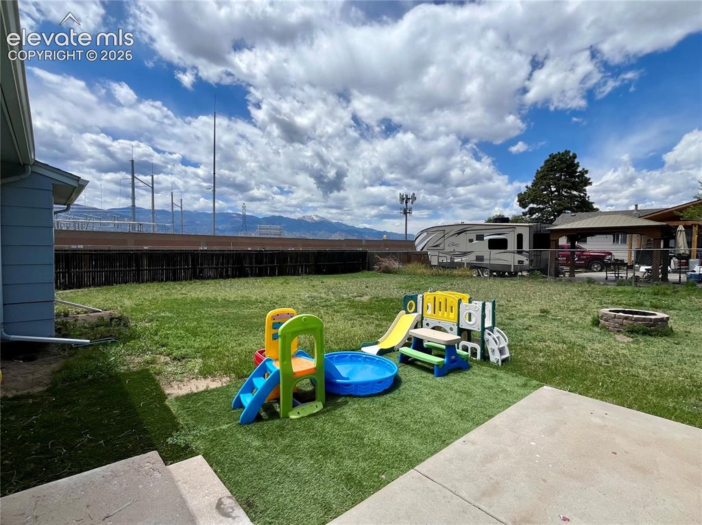 Image 19 of 21: Backyard patio area with room to relax or entertain