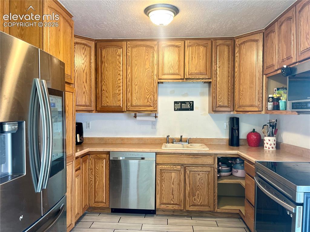 Image 3 of 21: Functional kitchen layout with ample prep space