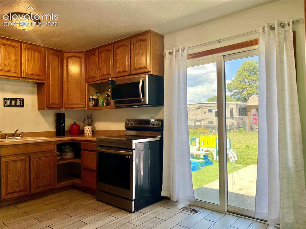 Image 5 of 21: Dining area with walk out access to backyard