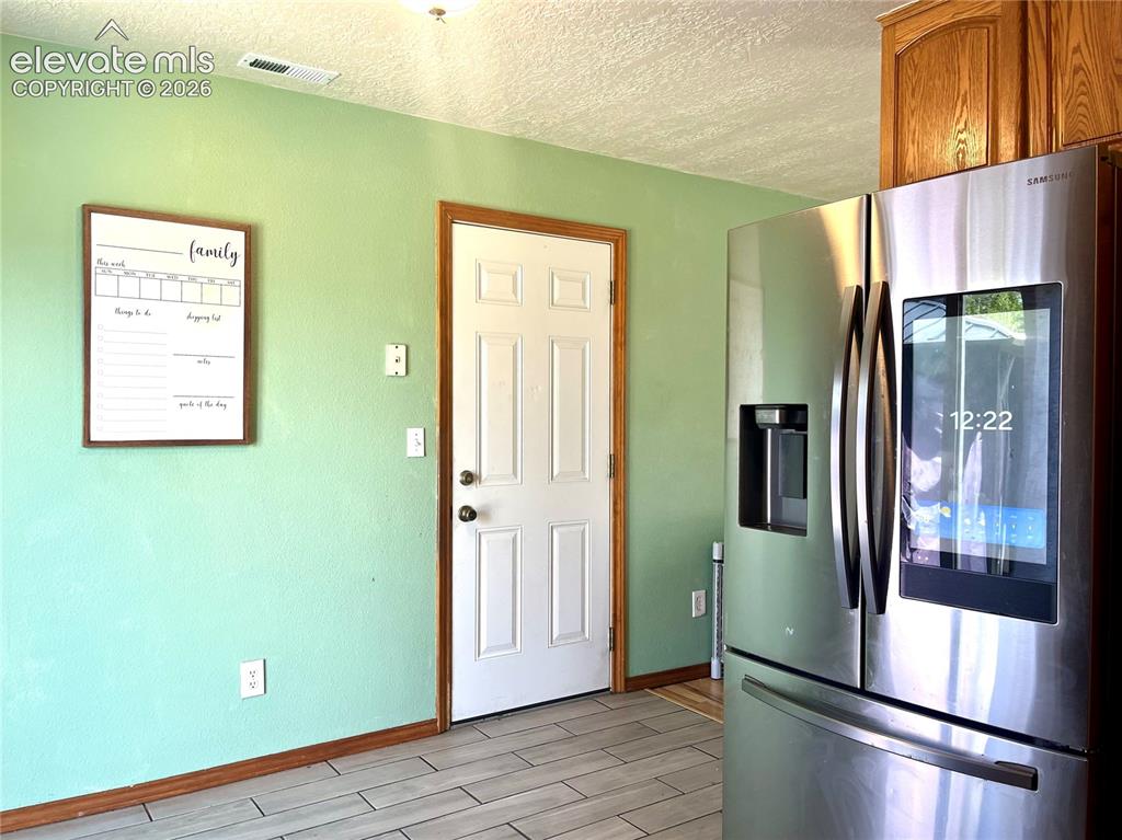 Image 9 of 21: Additional kitchen and dining view
