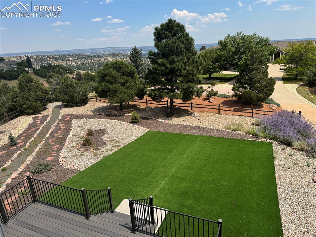 Image 18 of 48: View of yard with a deck