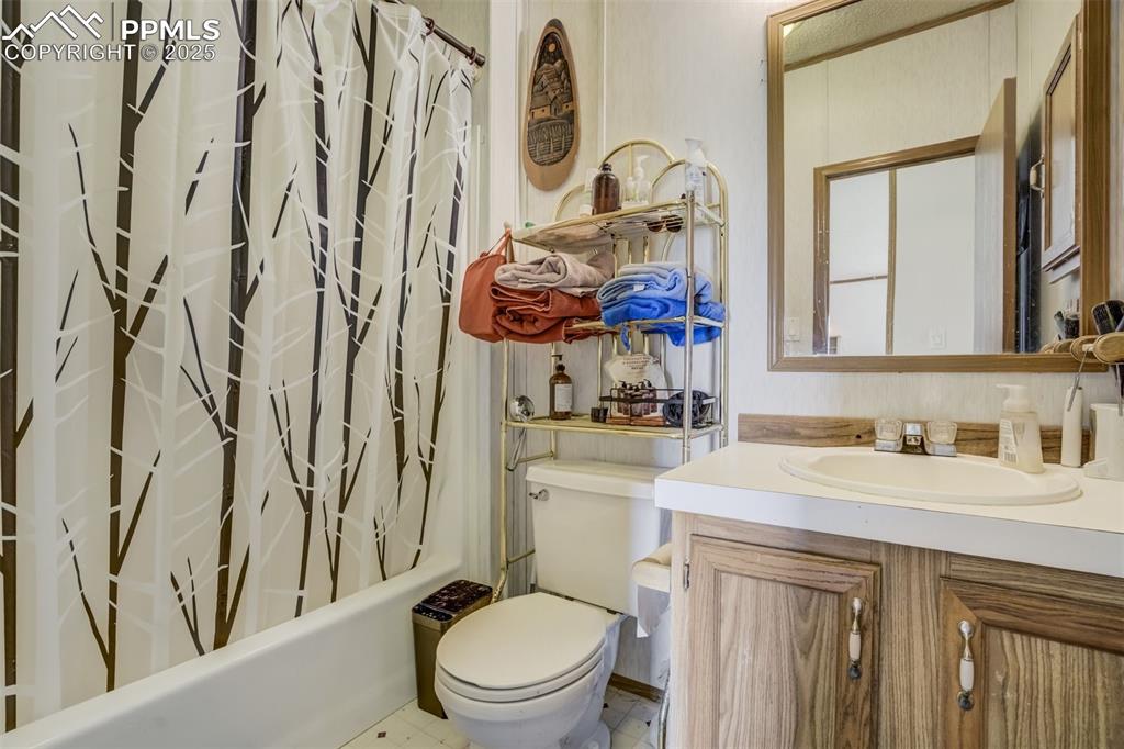 Image 24 of 50: Full bath with vanity and shower / tub combo