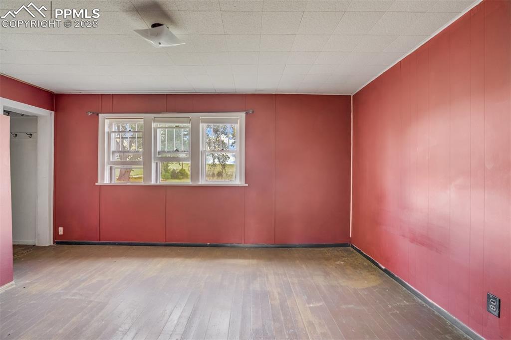 Image 39 of 50: Spare room with hardwood / wood-style flooring