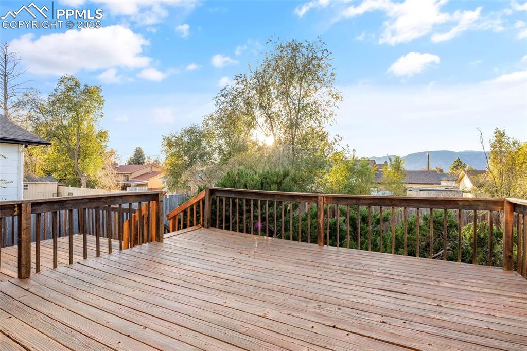 Image 24 of 28: Large two level wooden deck with amazing mountain views