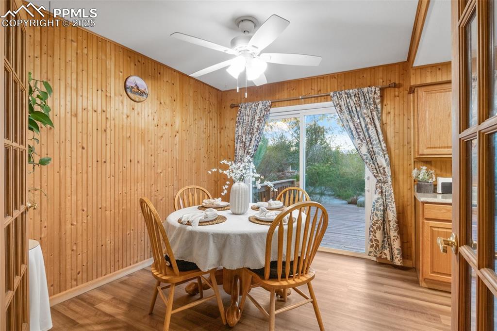 Image 5 of 28: Dining room with walkout to large wooden deck and gorgeous mountain views