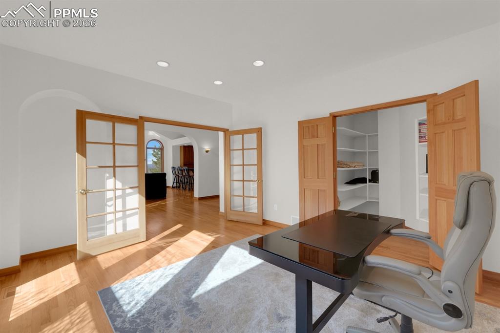 Image 13 of 48: Main level office with large walk-in closet