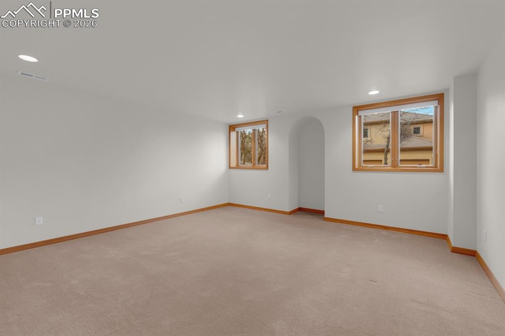 Image 33 of 48: Basement Bedroom with walk-in closet