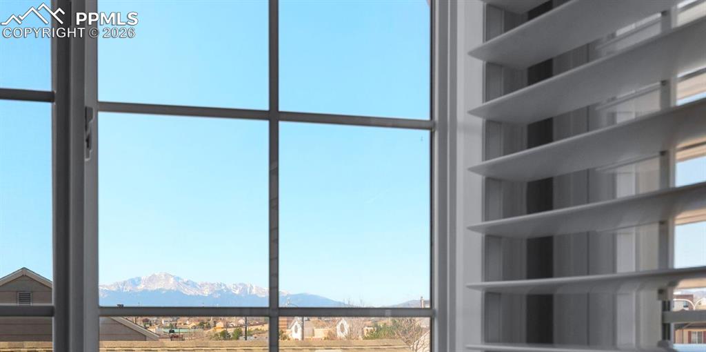 Image 18 of 50: Pikes Peak View From Primary Bedroom