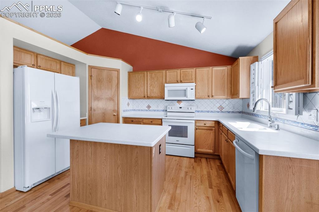 Image 3 of 50: Island Provides Extra Space For Food Prep