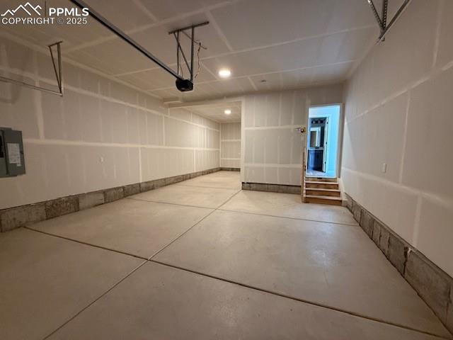 Image 4 of 11: Garage featuring electric panel