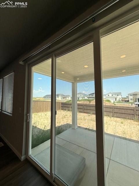 Image 7 of 11: Entryway with a residential view and dark wood-type flooring