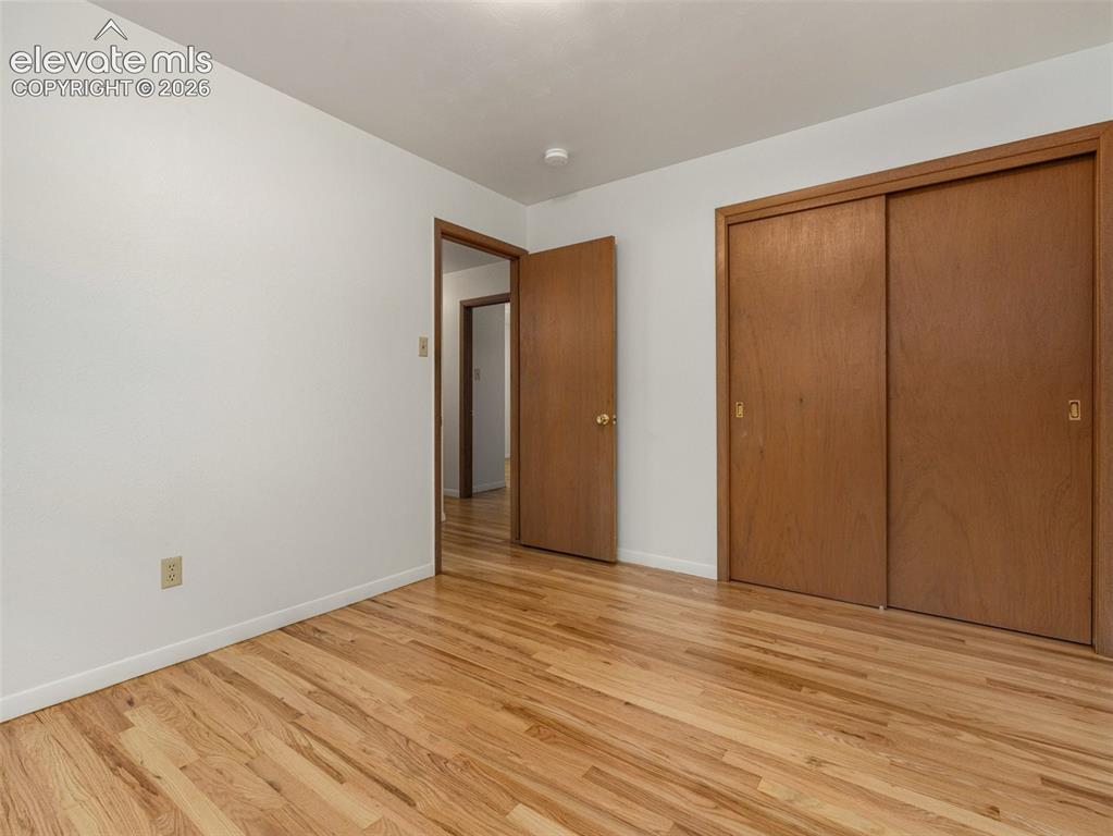 Image 14 of 34: Hardwood flooring throughout, with a neutral wall finish