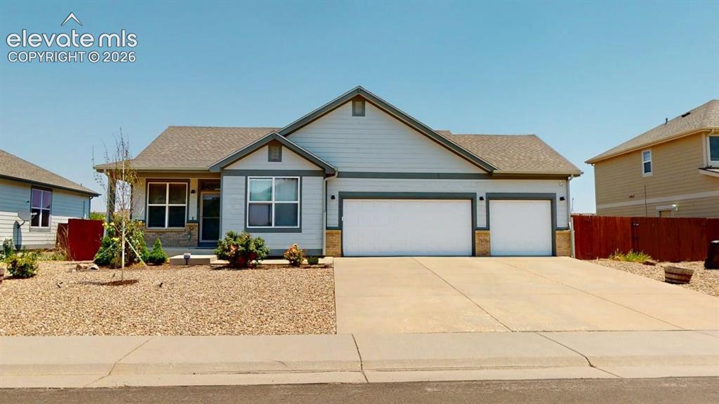 Image 1 of 20: Single-story residence featuring light gray siding with dark trim accents a