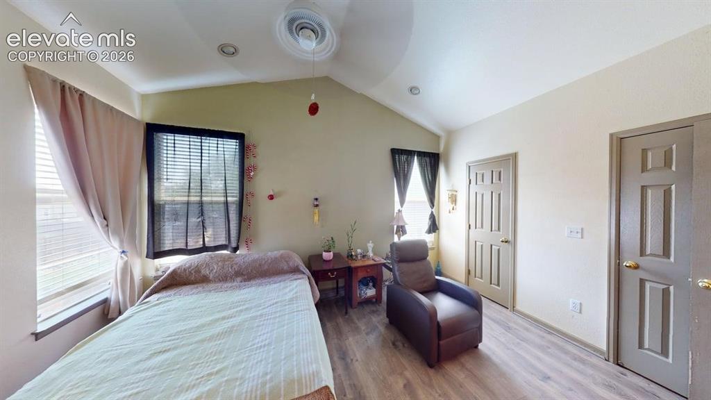 Image 15 of 20: Interior room featuring vaulted ceilings, ceiling fan, recessed lighting, a