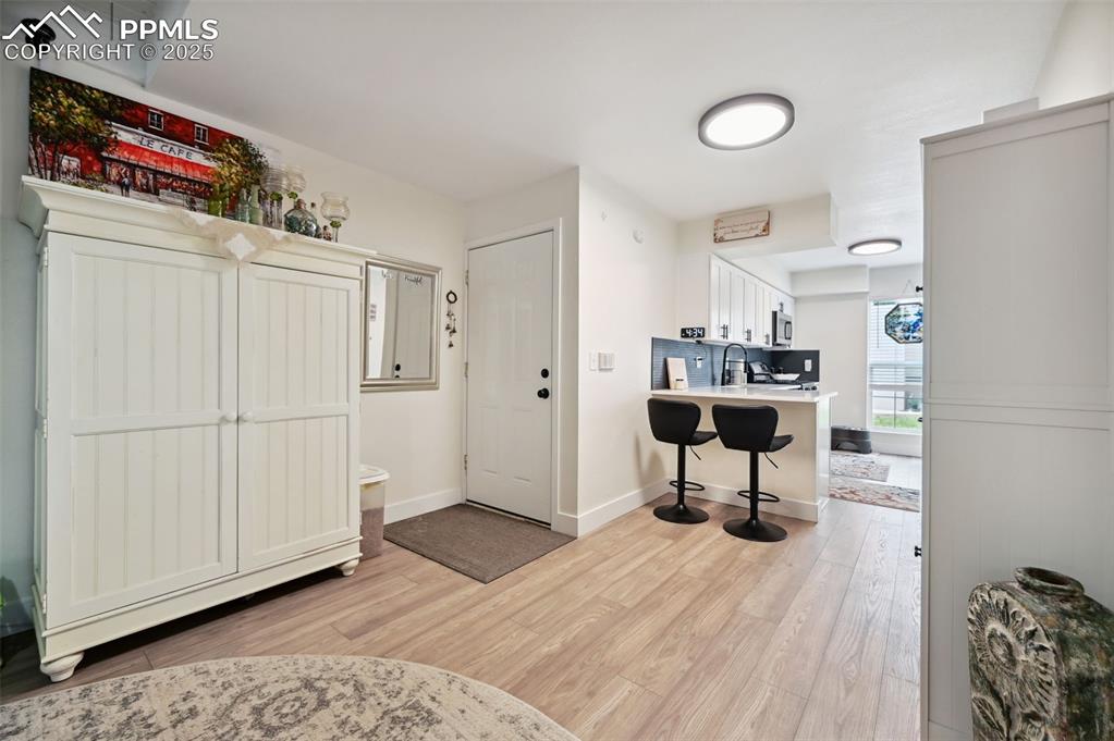 Image 10 of 16: Foyer featuring light wood-style floors and baseboards
