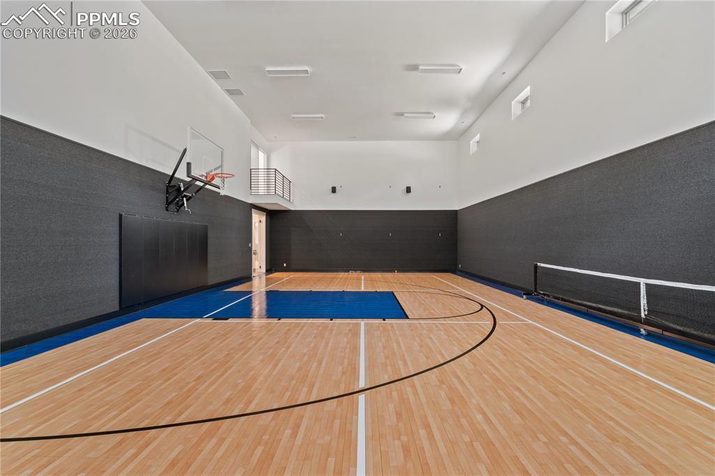 Image 2 of 48: Indoor sport court with basketball, batting cage and pickle ball court. 