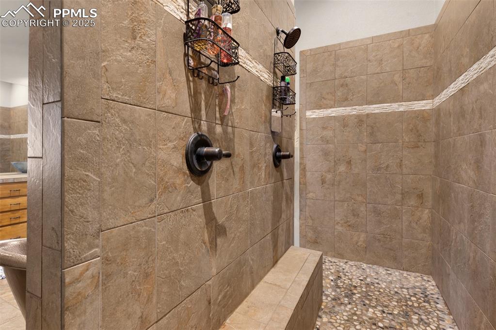 Image 20 of 48: Bathroom with tiled shower