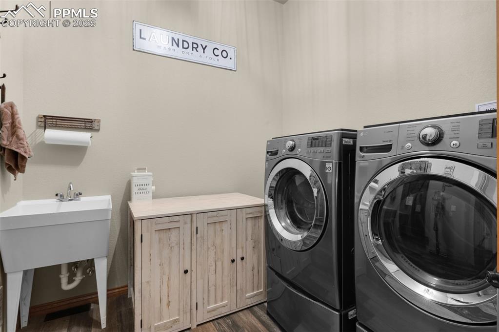 Image 26 of 48: main level laundry room with laundry tub