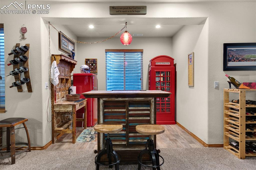 Image 32 of 48: basement family room bar area 