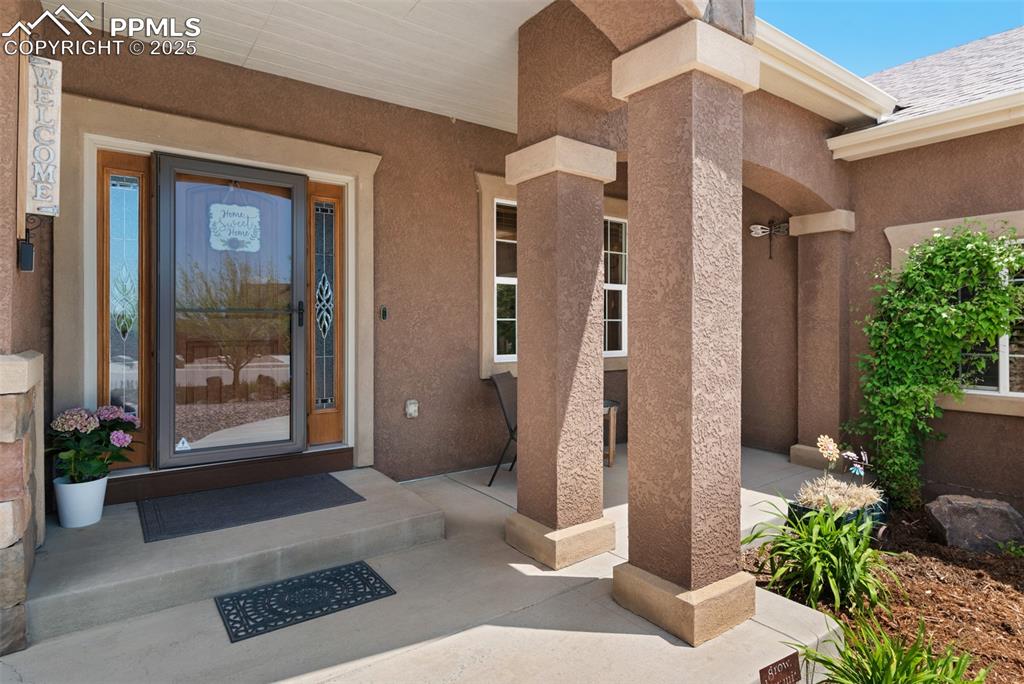 Image 4 of 48: View of exterior entry featuring covered porch 