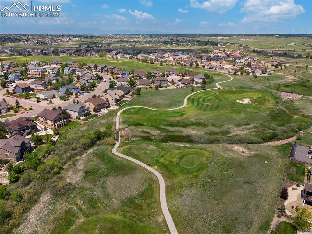 Image 45 of 48: Aerial view of property and surrounding area featuring nearby suburban area