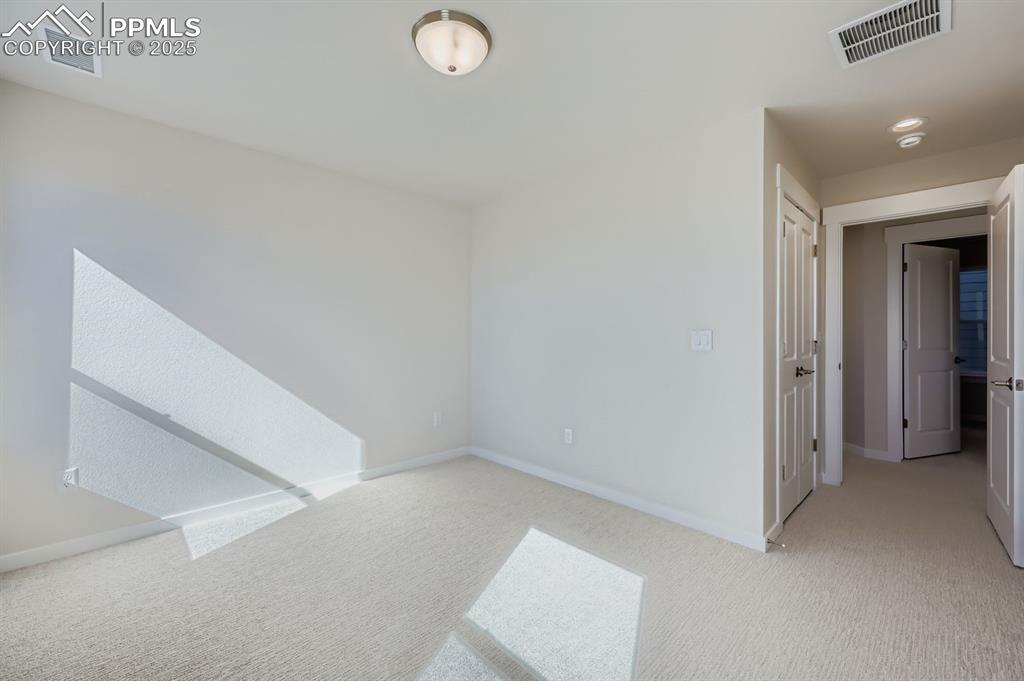 Image 16 of 27: Spare room featuring carpet and recessed lighting
