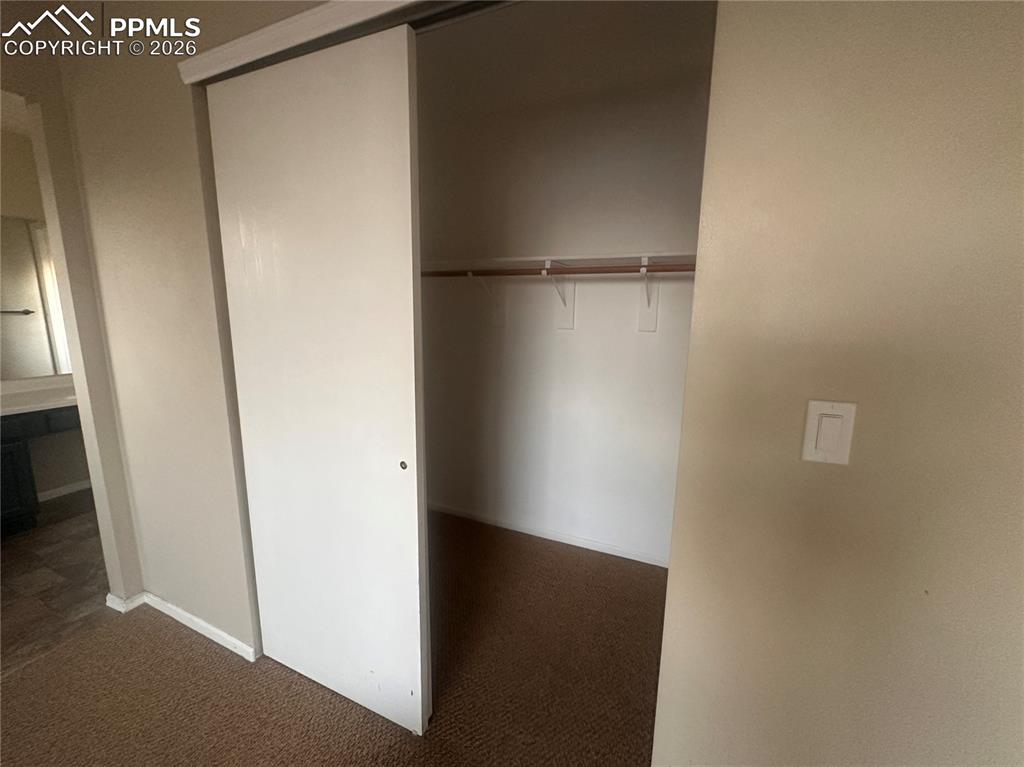 Image 24 of 33: Closet in primary bedroom