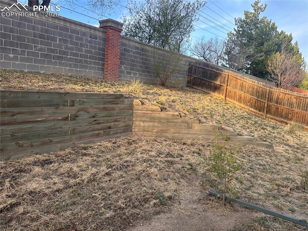 Image 30 of 33: Backyard is terraced