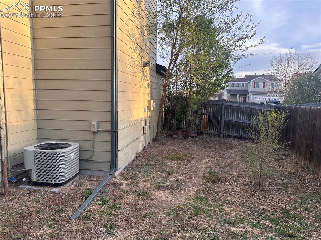 Image 32 of 33: Side yard with air conditioner