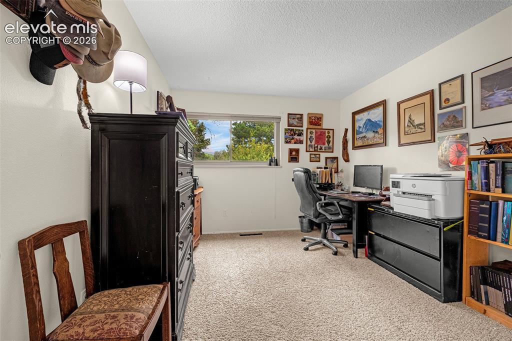 Image 21 of 45: Bedroom 3- currently being used as office.