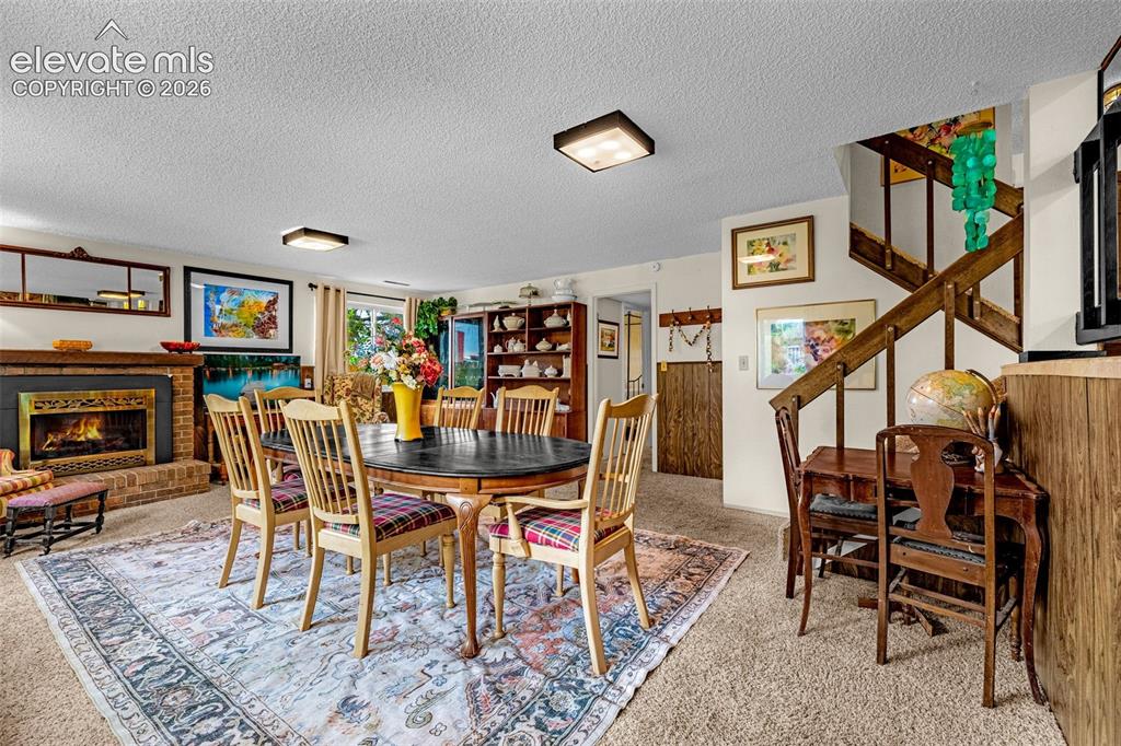 Image 23 of 45: Family Room - Currently being used as dining area complete with brick firep