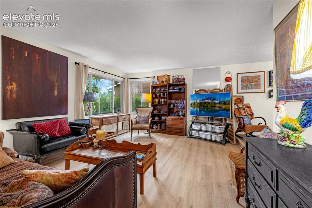 Image 5 of 45: Open concept Living room with light wood-finish flooring