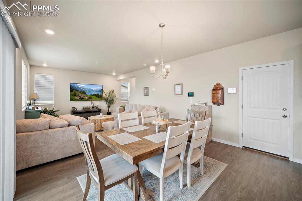 Image 10 of 40: Dining space with access to the garage and back yard.
