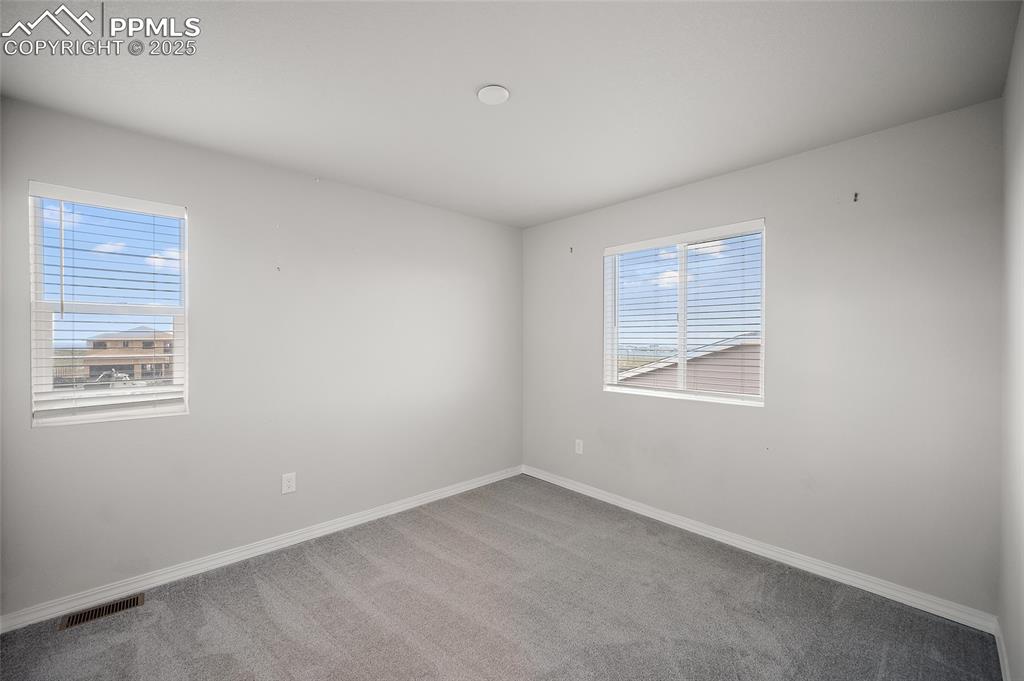 Image 16 of 40: Bedroom 1 located above the living room.