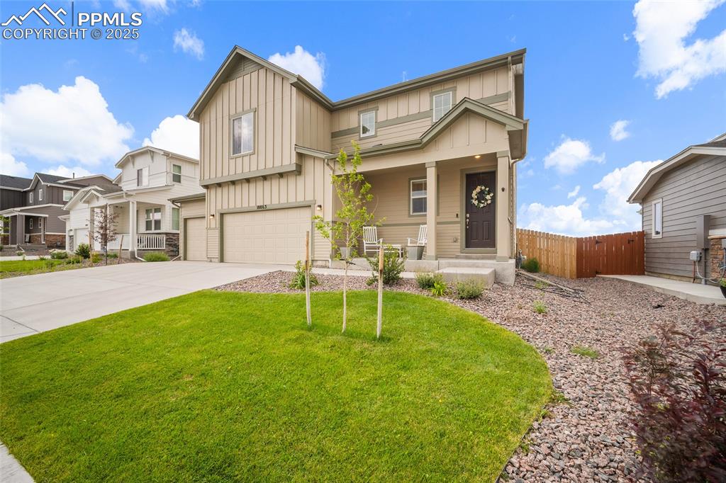 Image 2 of 40: Front view of home featuring natural grass and completed landscaping.