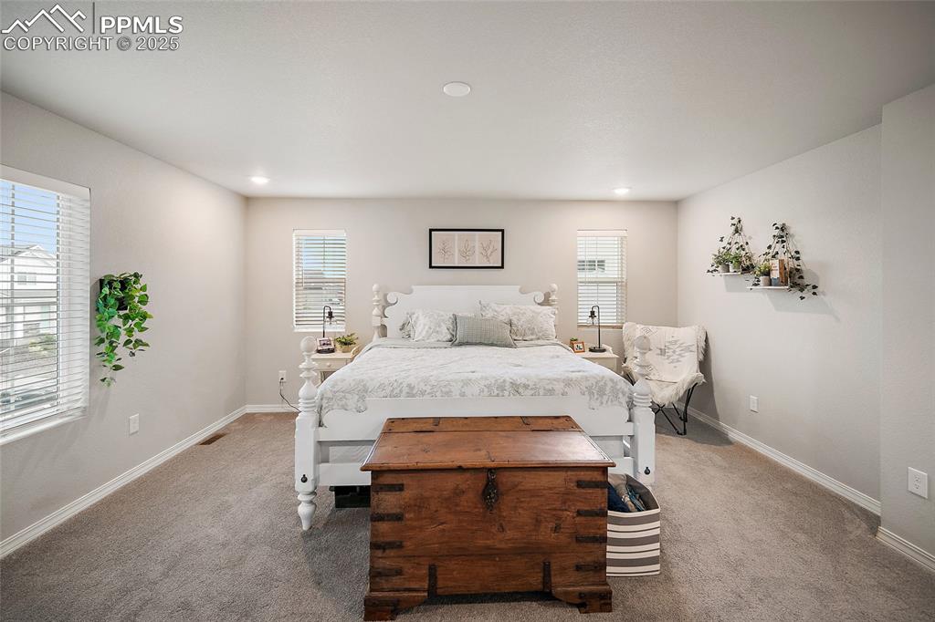 Image 23 of 40: Primary bedroom with recessed lighting and pre-wire for fan.