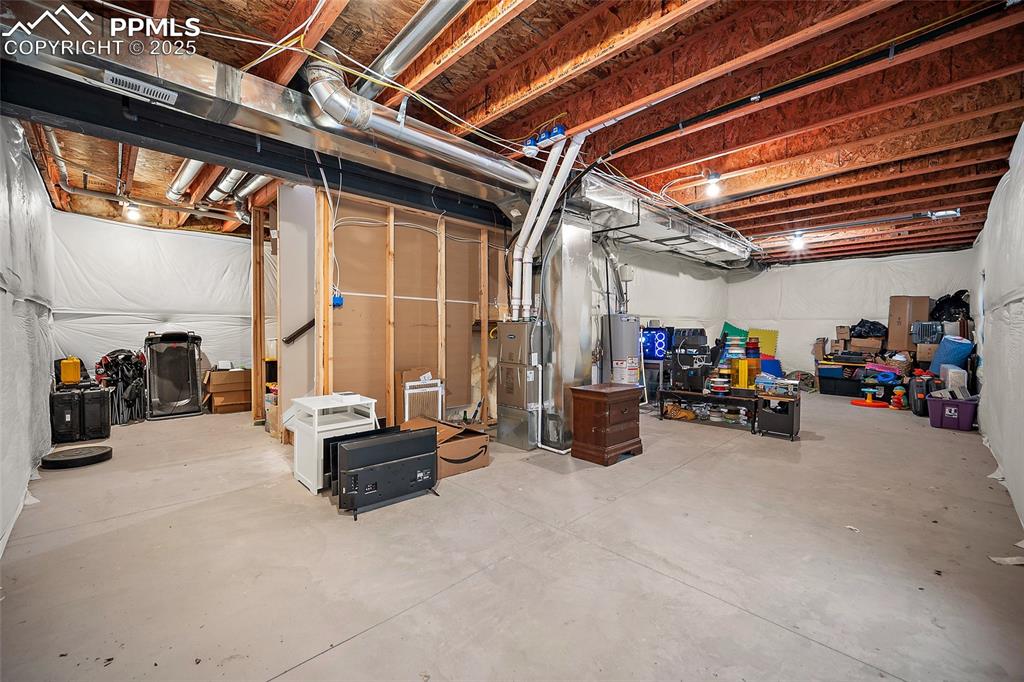 Image 30 of 40: Unfinished basement located under the living room.