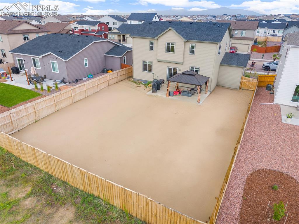 Image 4 of 40: This large back yard is a blank canvas for you to bring your vision to life