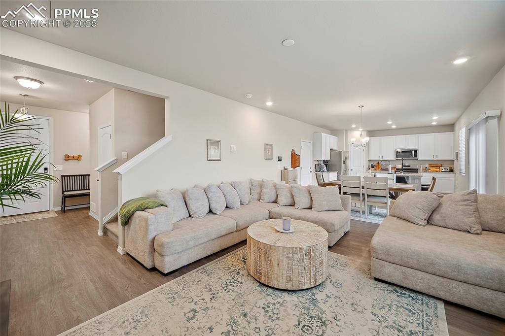 Image 8 of 40: Living area with recessed lighting and a healthy amount of natural light.